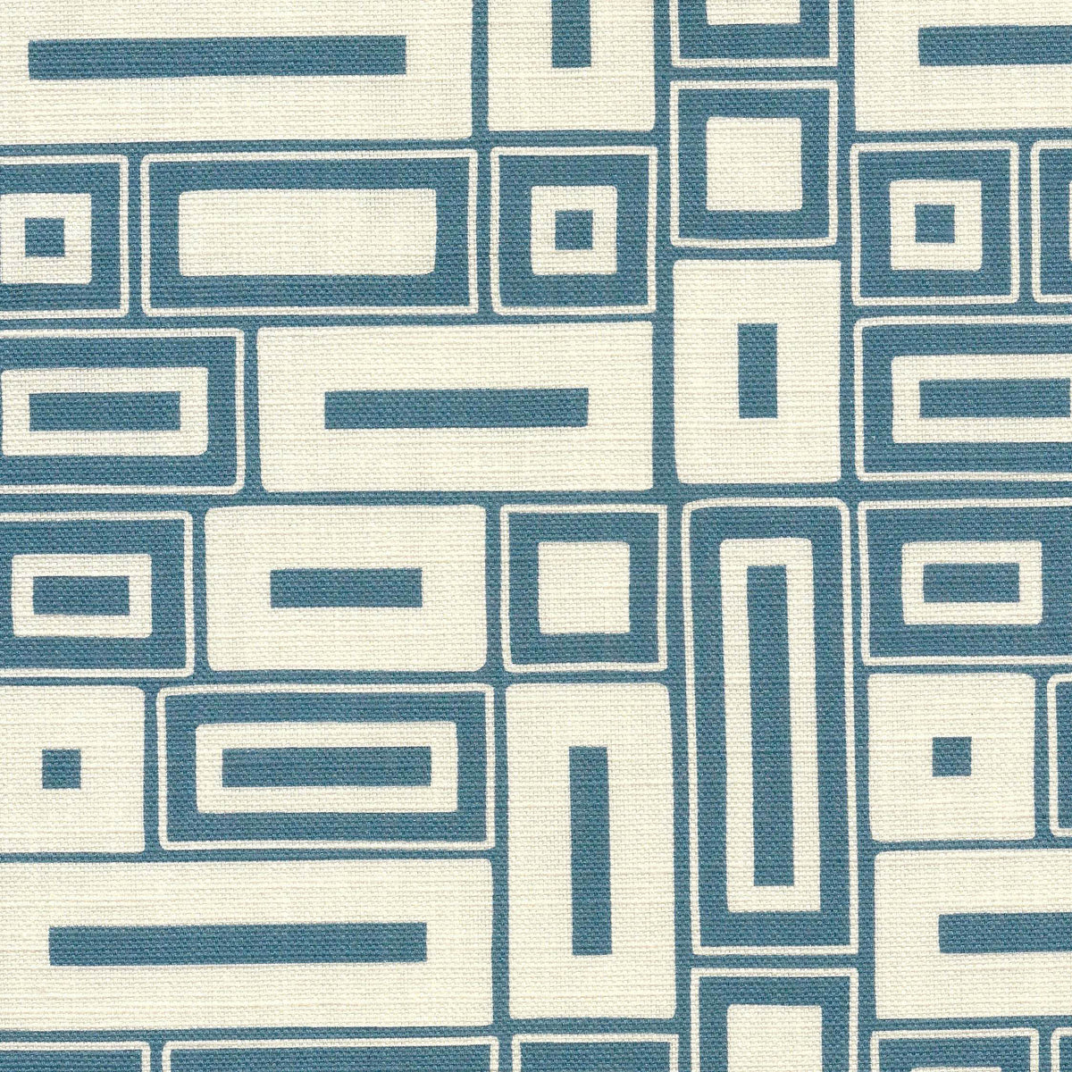A chalky blue motif on a natural ground, this two-colour fabric has the look of a traditional block-printed design.