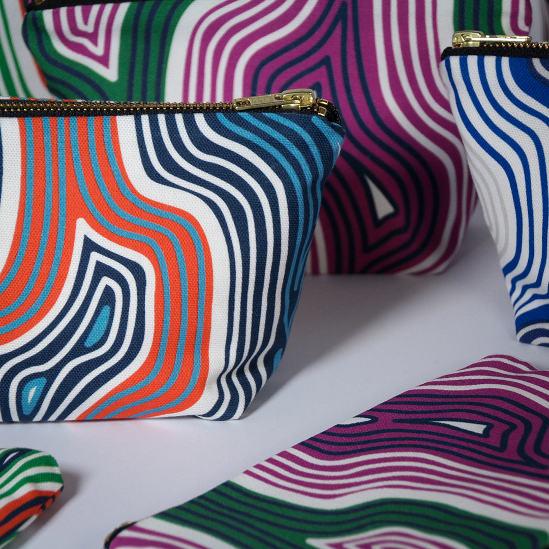 Collection of our Lasdun large cotton zip pouches. Printed and handmade in England.