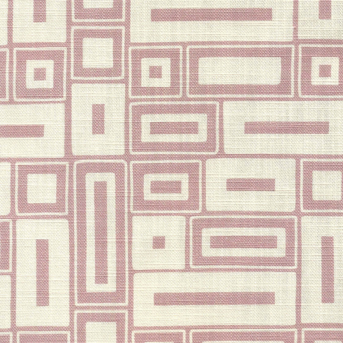 A close-up of a printedfabric with a repeating geometric pattern of pink rectangles and lines on a warm off-white background.