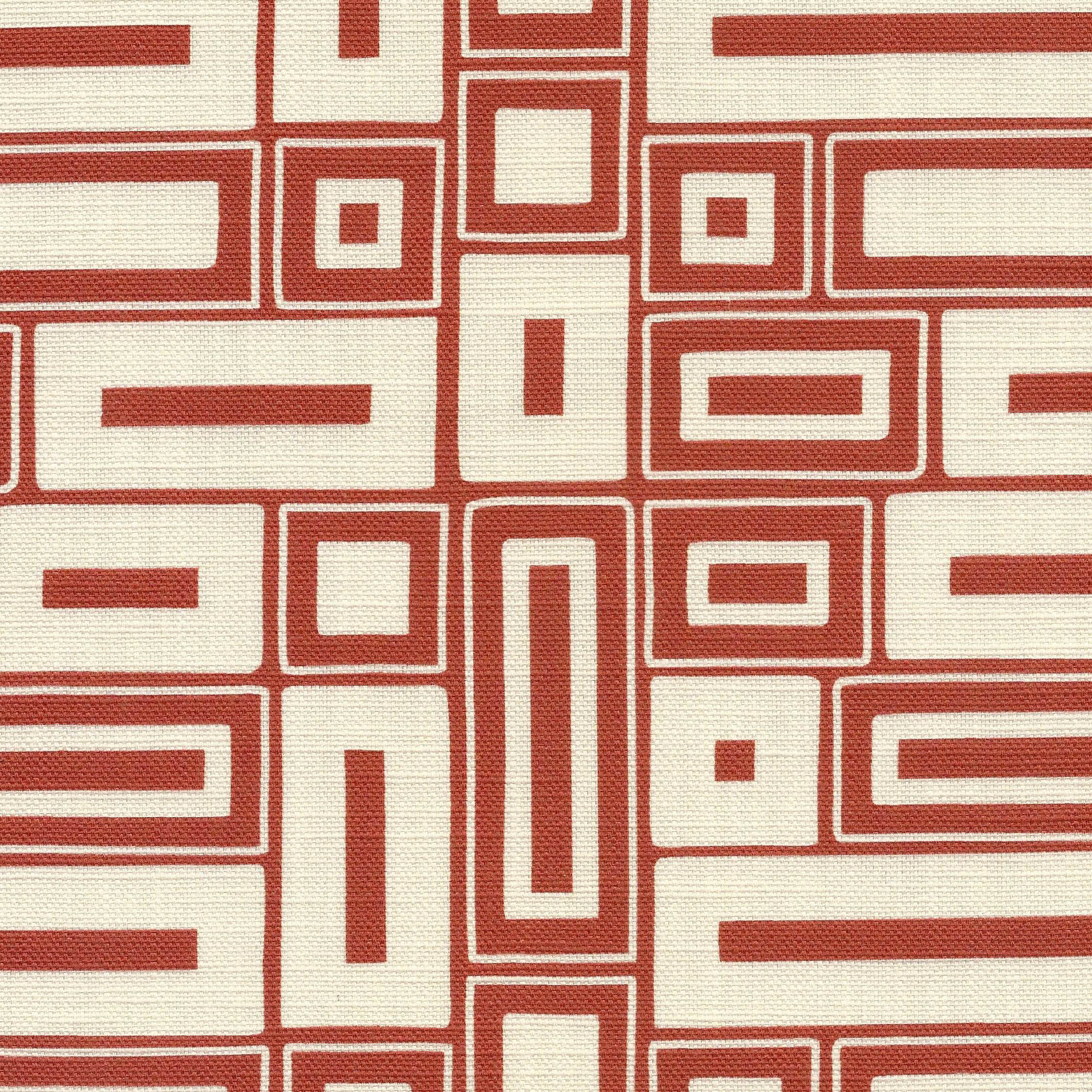 A close-up of a printed fabric with a repeating geometric pattern of red rectangular and square outlines on an off-white background.