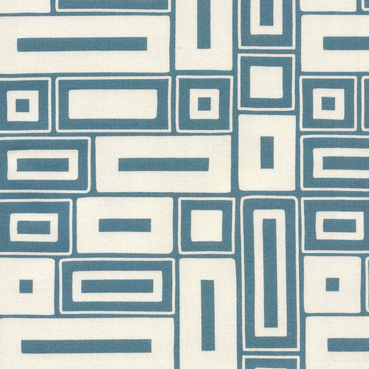 a chalky blue motif on a natural ground, this two-colour fabric has the look of a traditional block-printed design.
