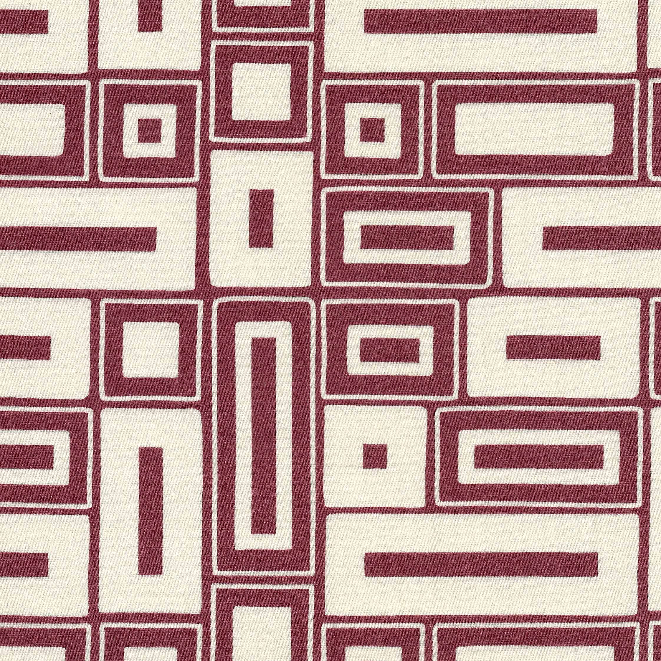 A close-up of a geometric patterned fabric featuring alternating cream and burgundy rectangular blocks outlined with thin intersecting lines.
