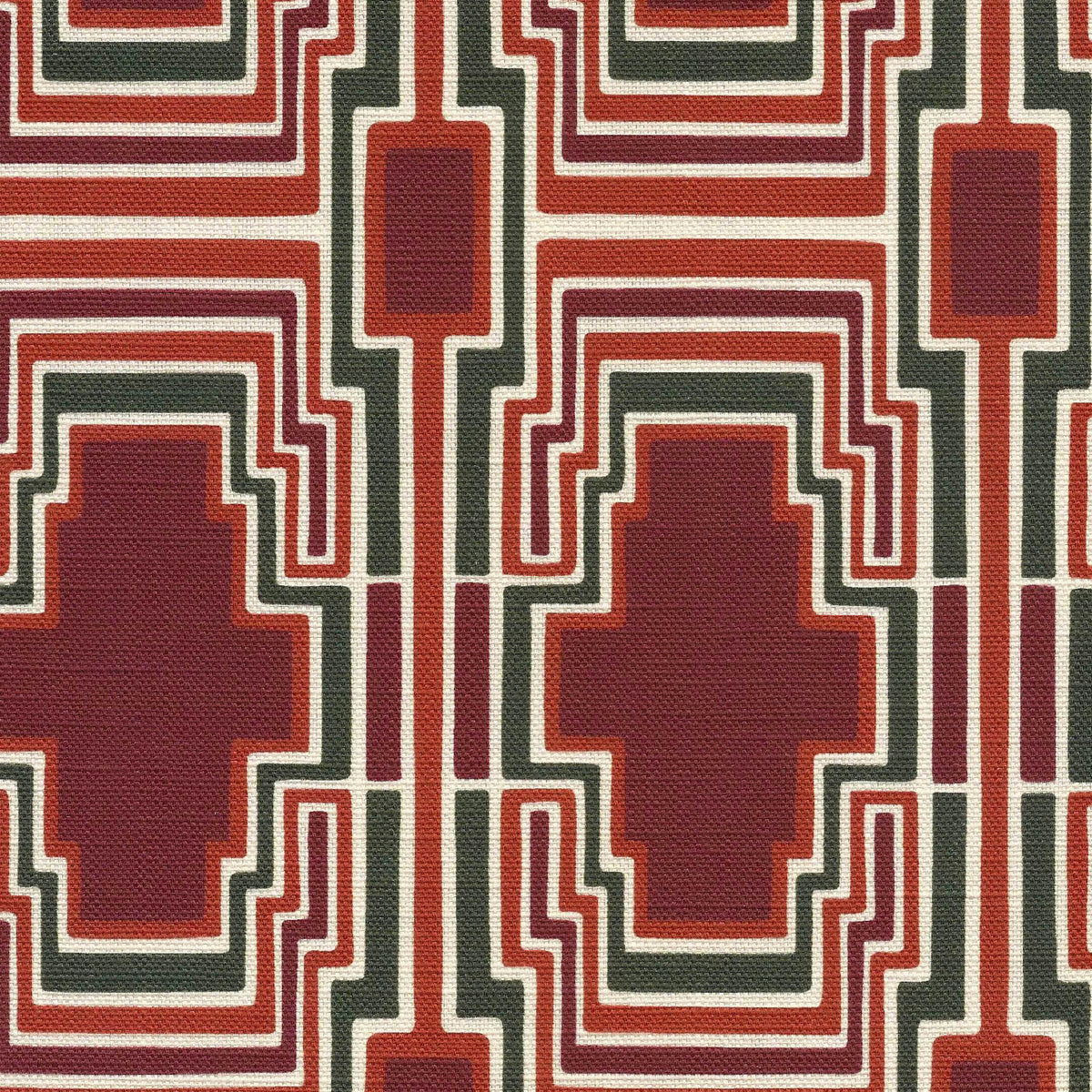 Geometric pattern with terracotta, burgundy and green shapes on a fabric background