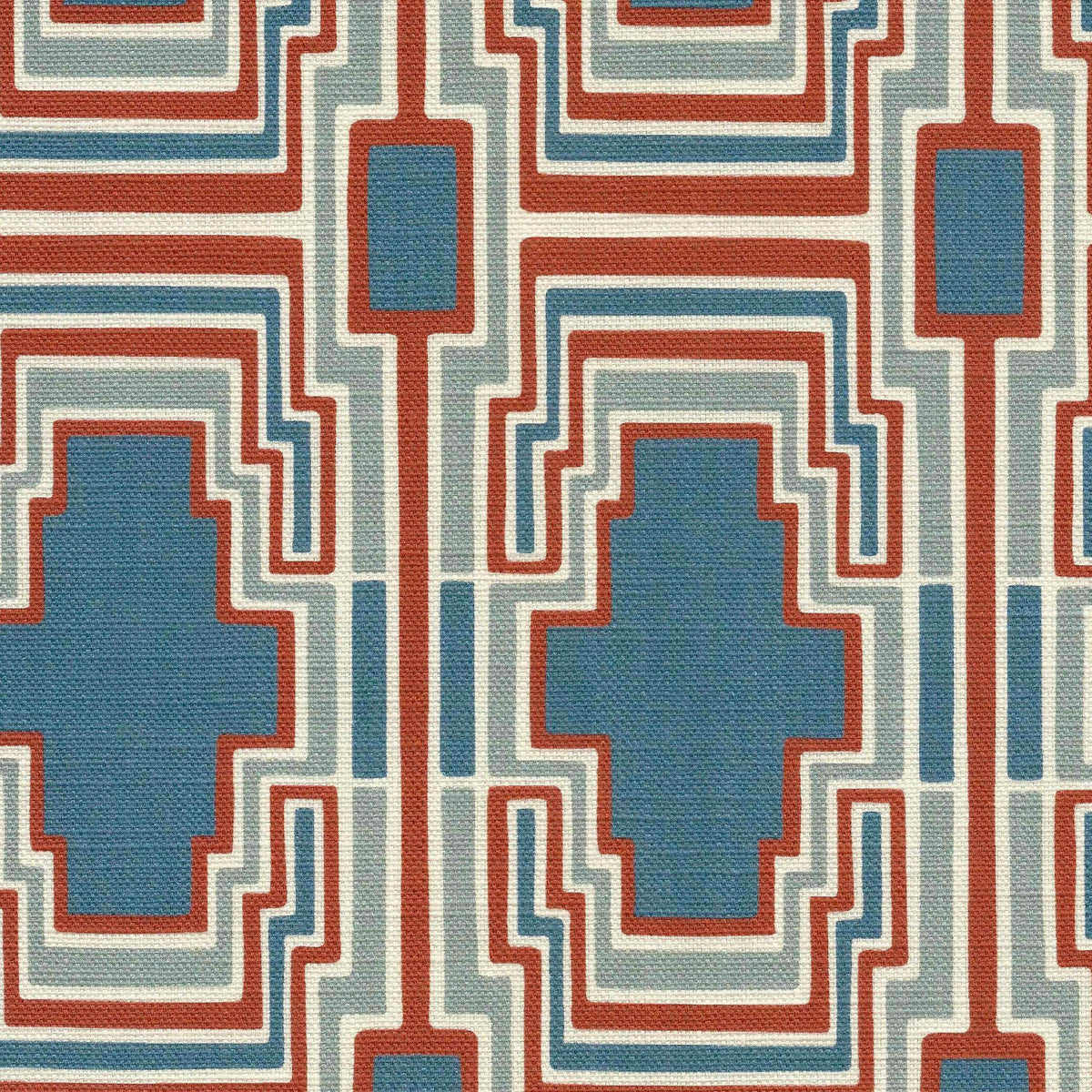 a geometric pattern with blue, terracotta, and  ivory colours on a textured fabric background