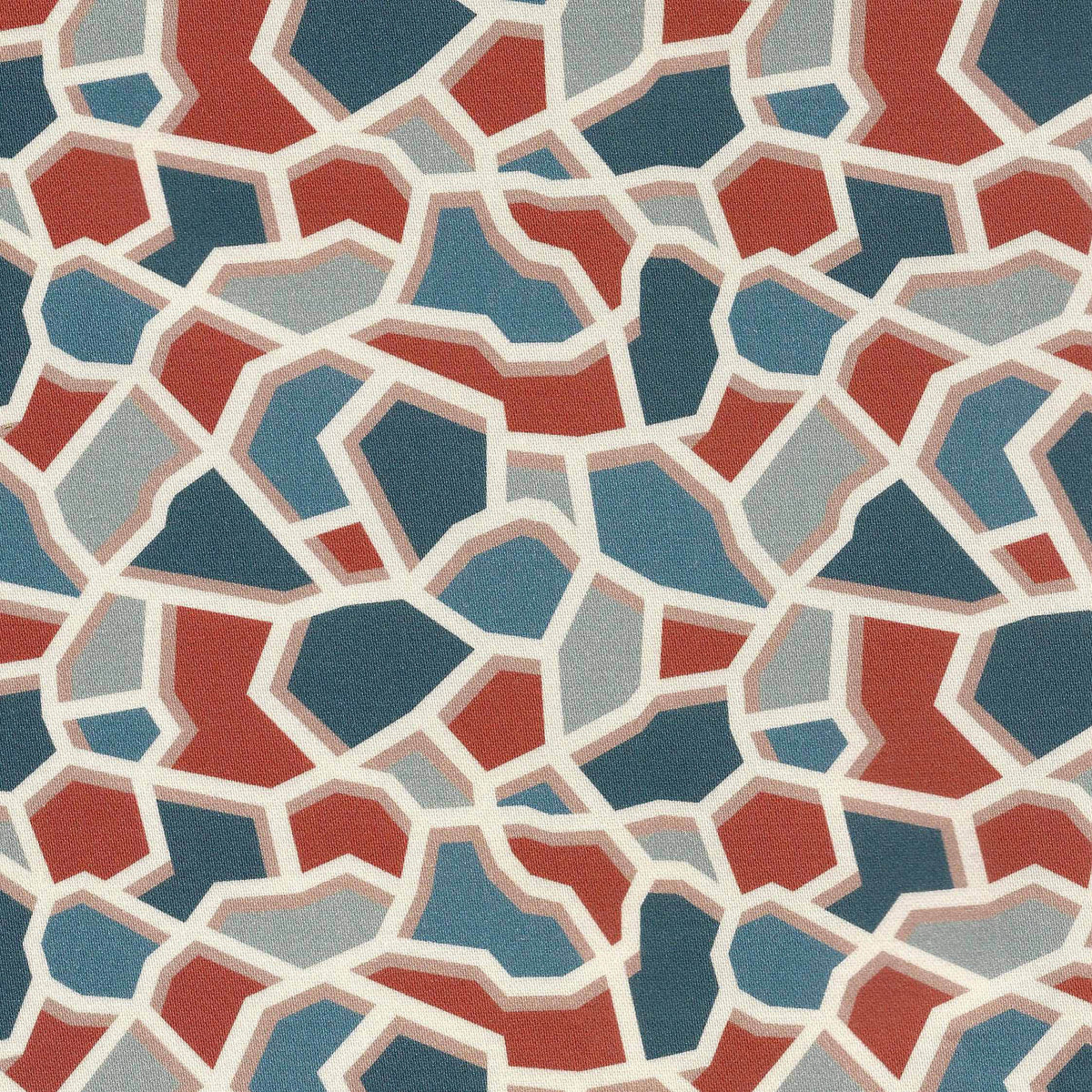 Abstract printed fabric with polygon shapes in terracotta, blue with an ivory outline.
